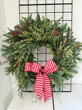 Load image into Gallery viewer, Christmas wreath with red berries and a red and white striped bow on a white background